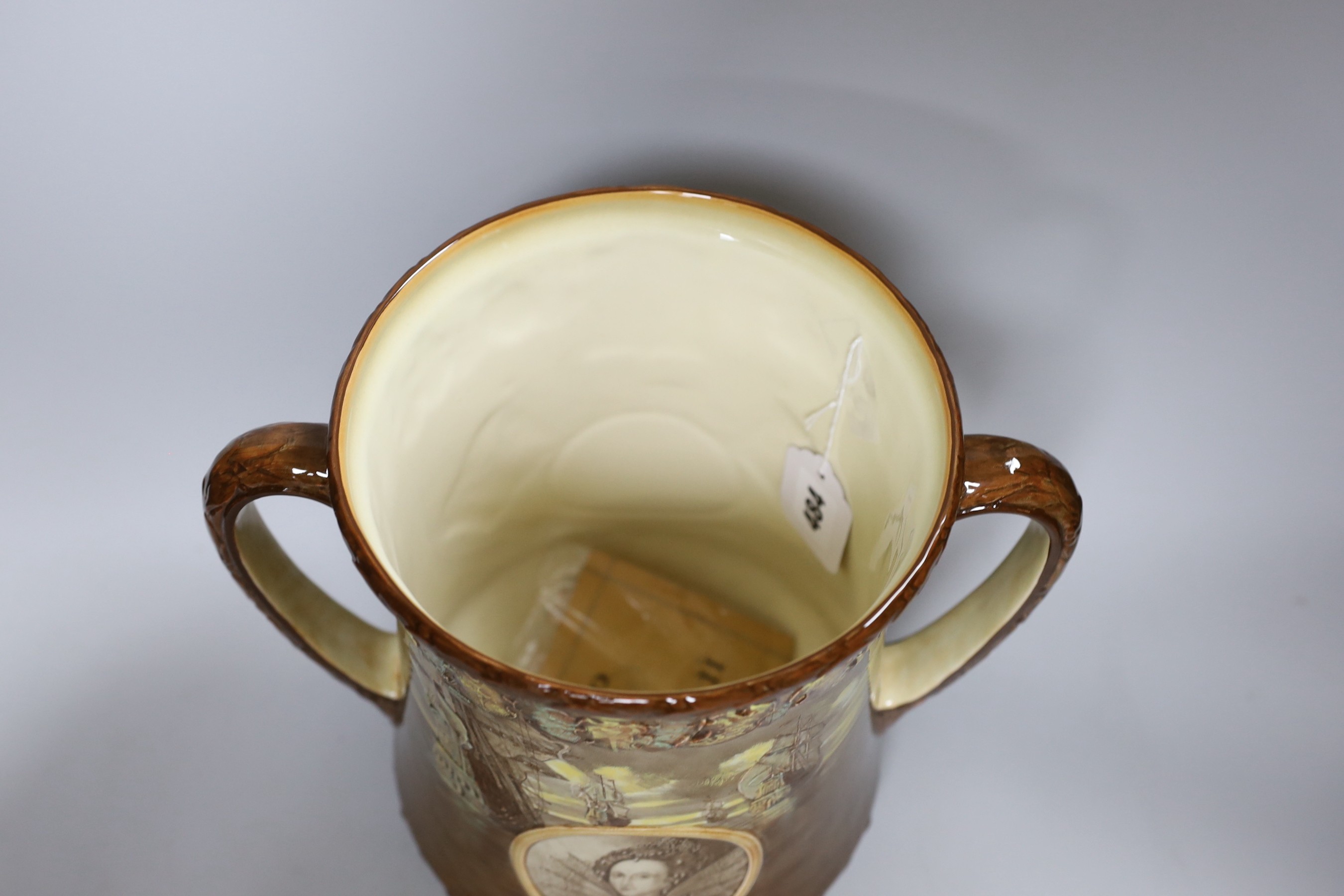 A Royal Doulton loving cup, Elizabeth II Coronation June 1953, 554 of 1000 with certificate signed by Art Director, Cecil J Noke, 27cms high